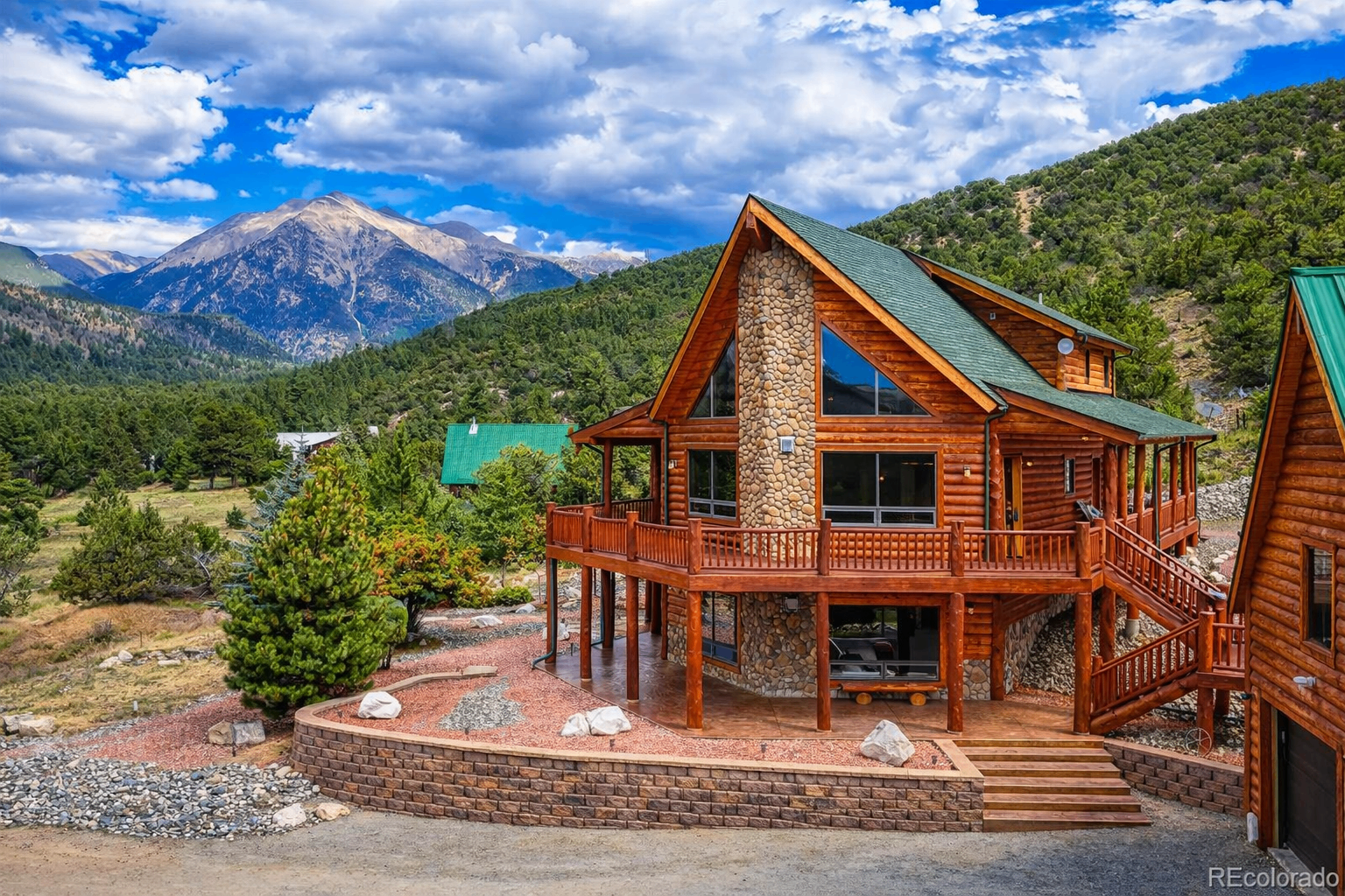 Log cabin mountain home with a wraparound deck and sweeping views of the Sawatch Range