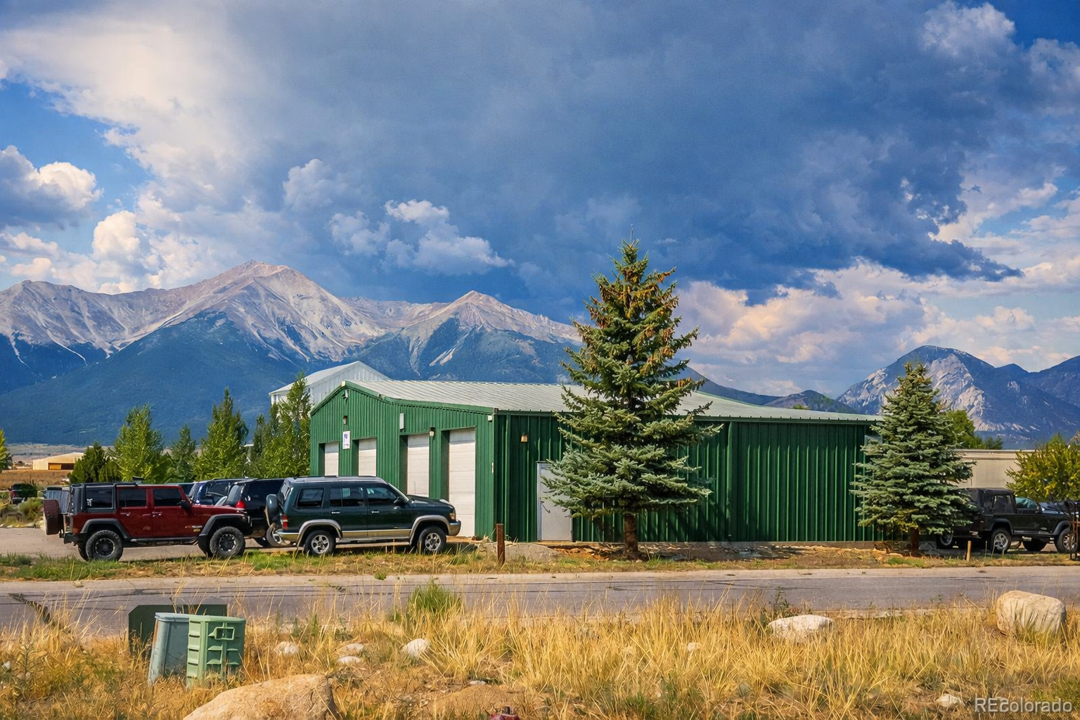 Green metal commercial building with mountain views in Chaffee County